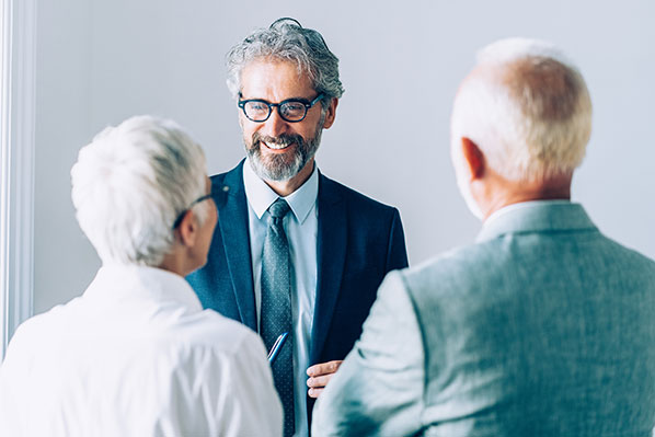 An advisor speaking with an senior couple