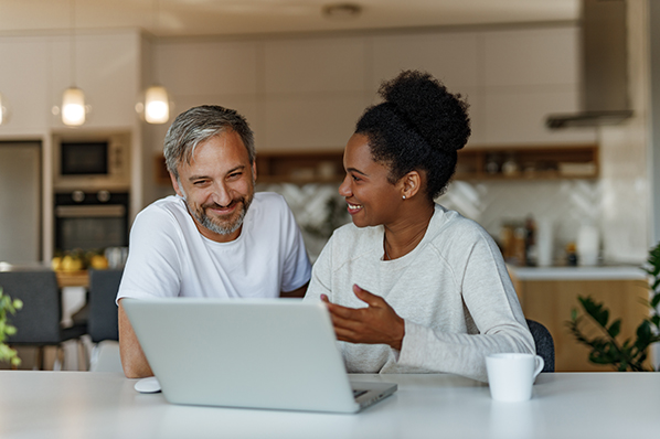 A couple working on a laptop