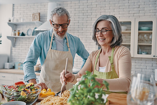 Mature couple cooking in a kitchen
