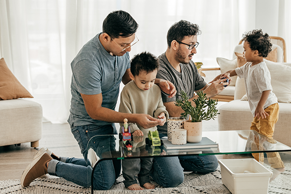 two days playing with their toddler kids in the living room