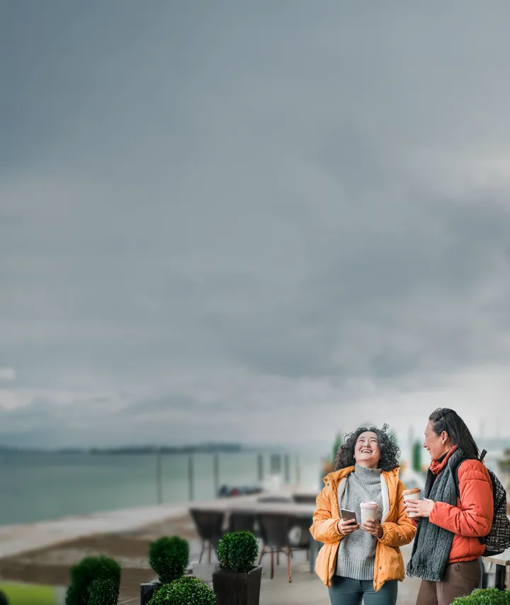 Two friends chatting on a walk